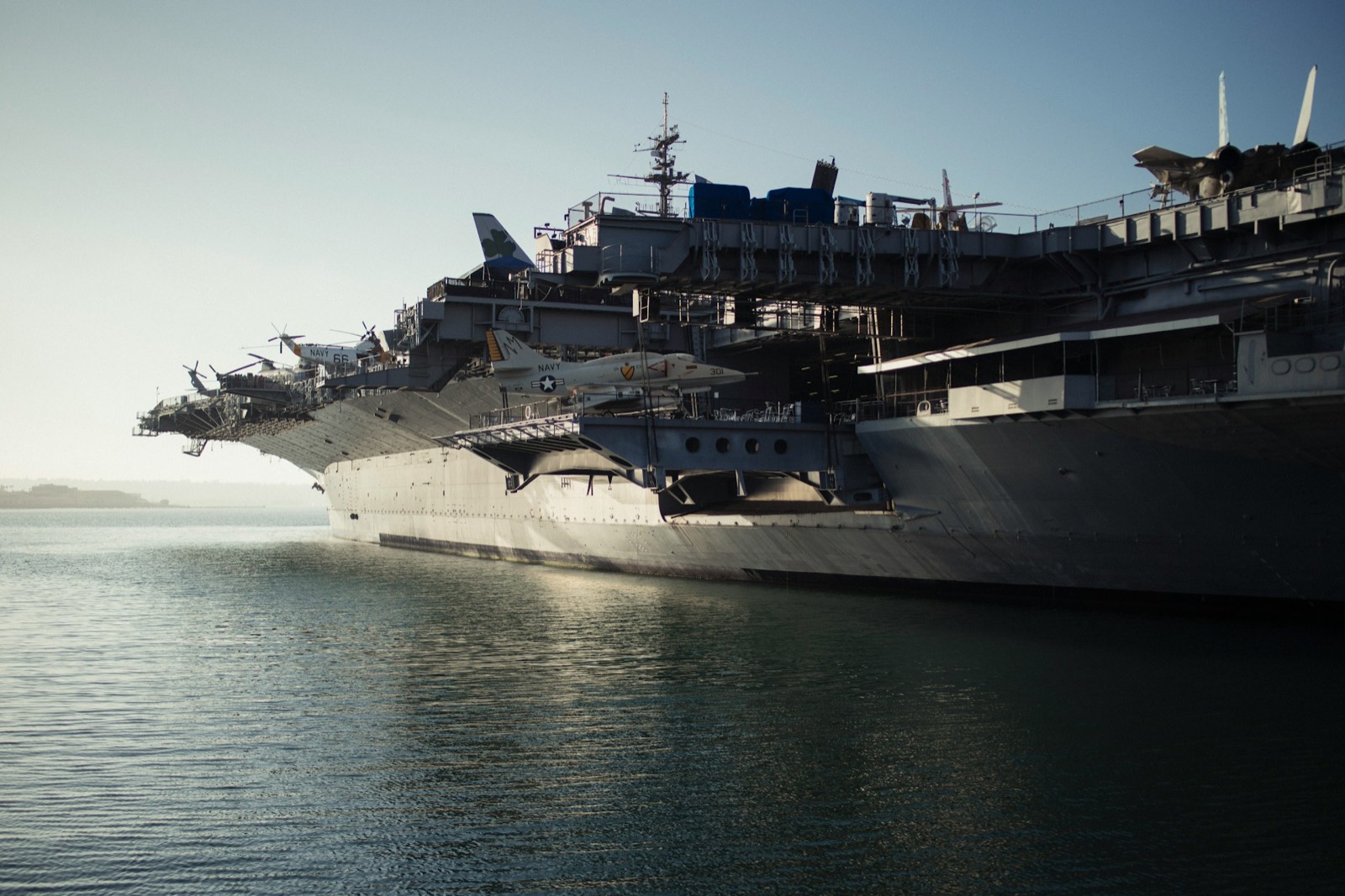 Aircraft carrier pierside at dawn